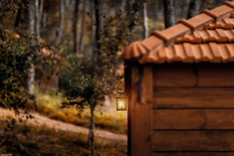 Little Nice Wooden House in the Forest with Bright Glowing Lantern. Perfect Place for Escape and Peaceful Weekend. Vacation in the Nature.